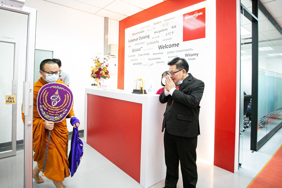 Buddhist monks gather in Bystronic Thailand company.